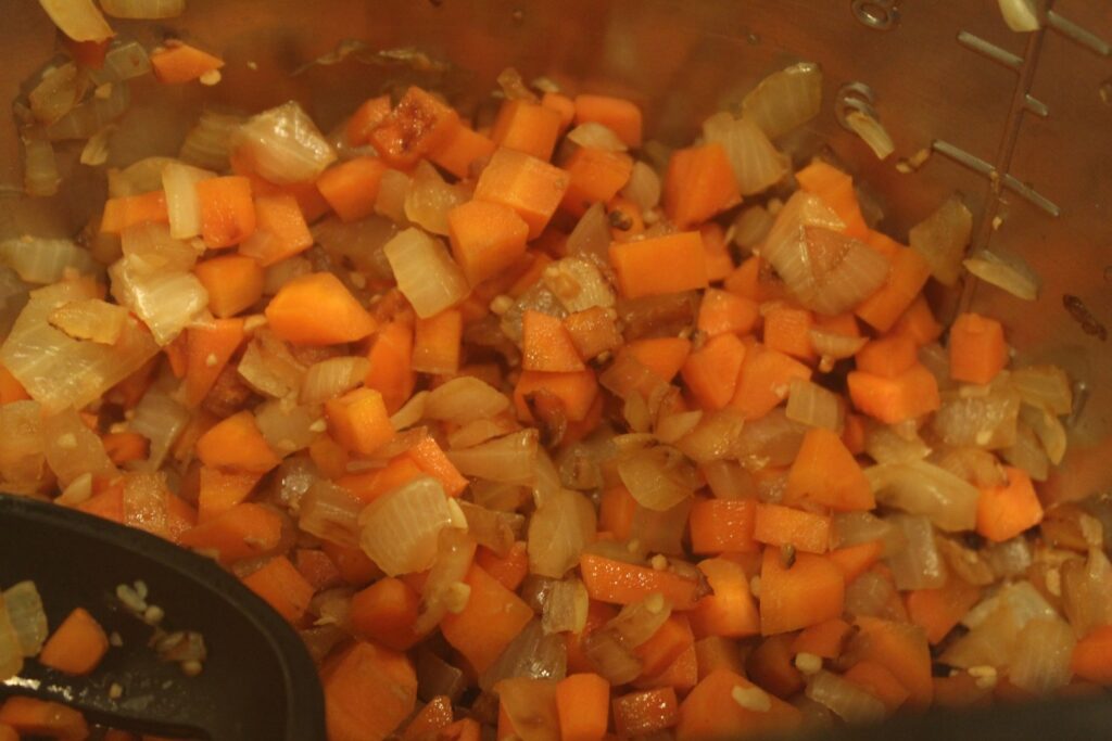 Sauted, diced carrot, onion, and garlic.