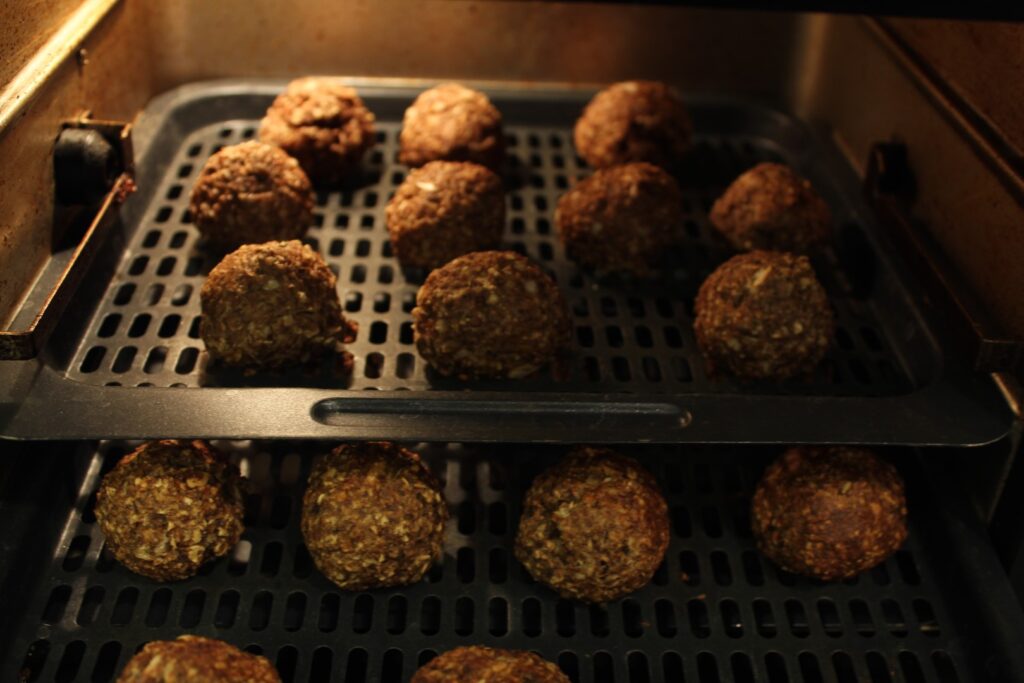 Cooked mushroom meatballs in an air-fryer.