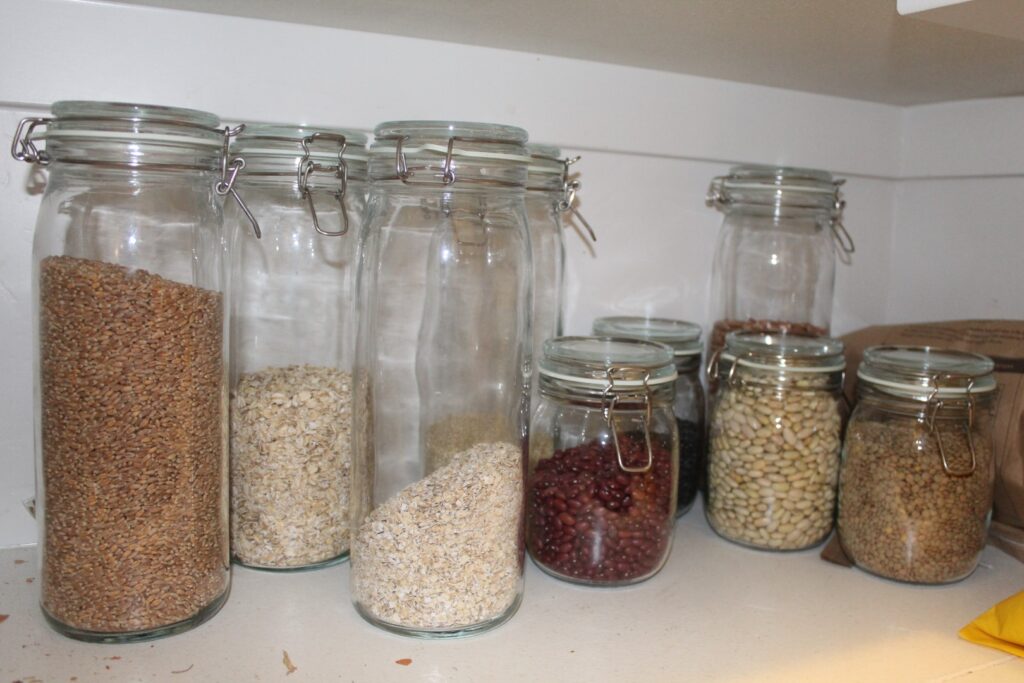 Jars of beans and grains in a pantry