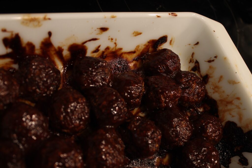 BBQ sauce covered mushroom meatballs.