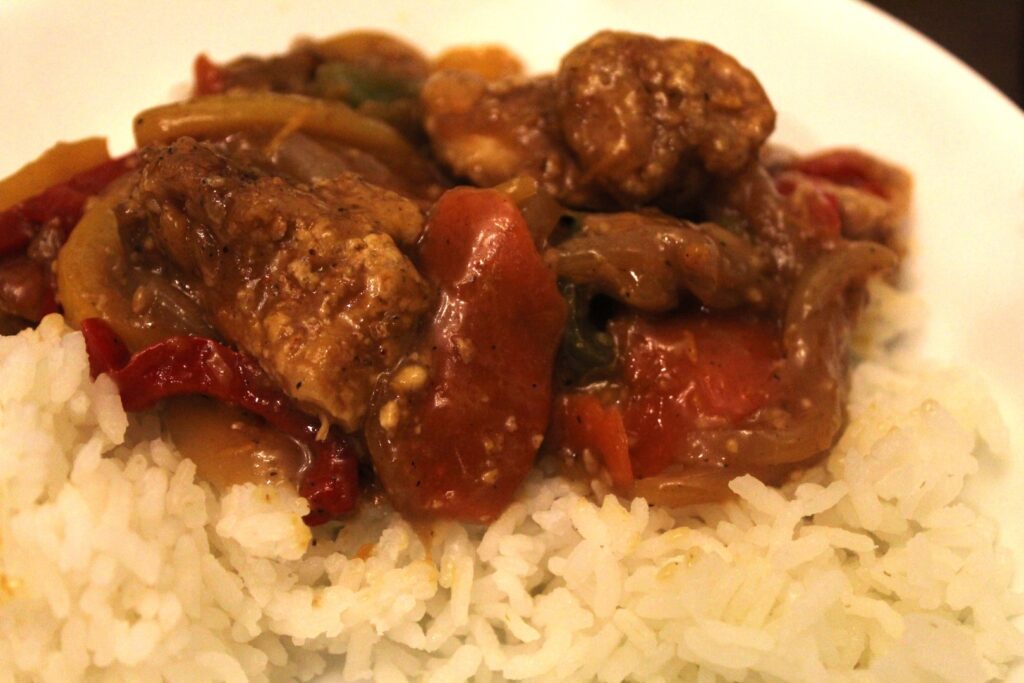 Mess free air-fryer orange chicken served on top of white rice.