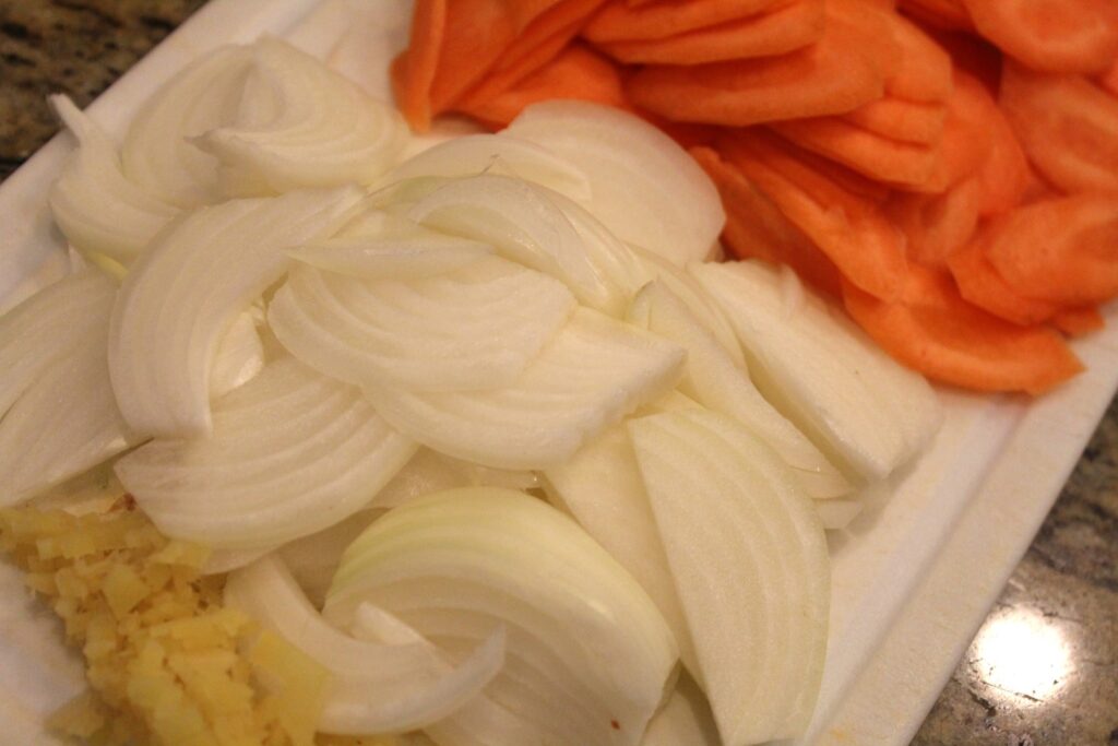 Sliced carrot onion and minced ginger.