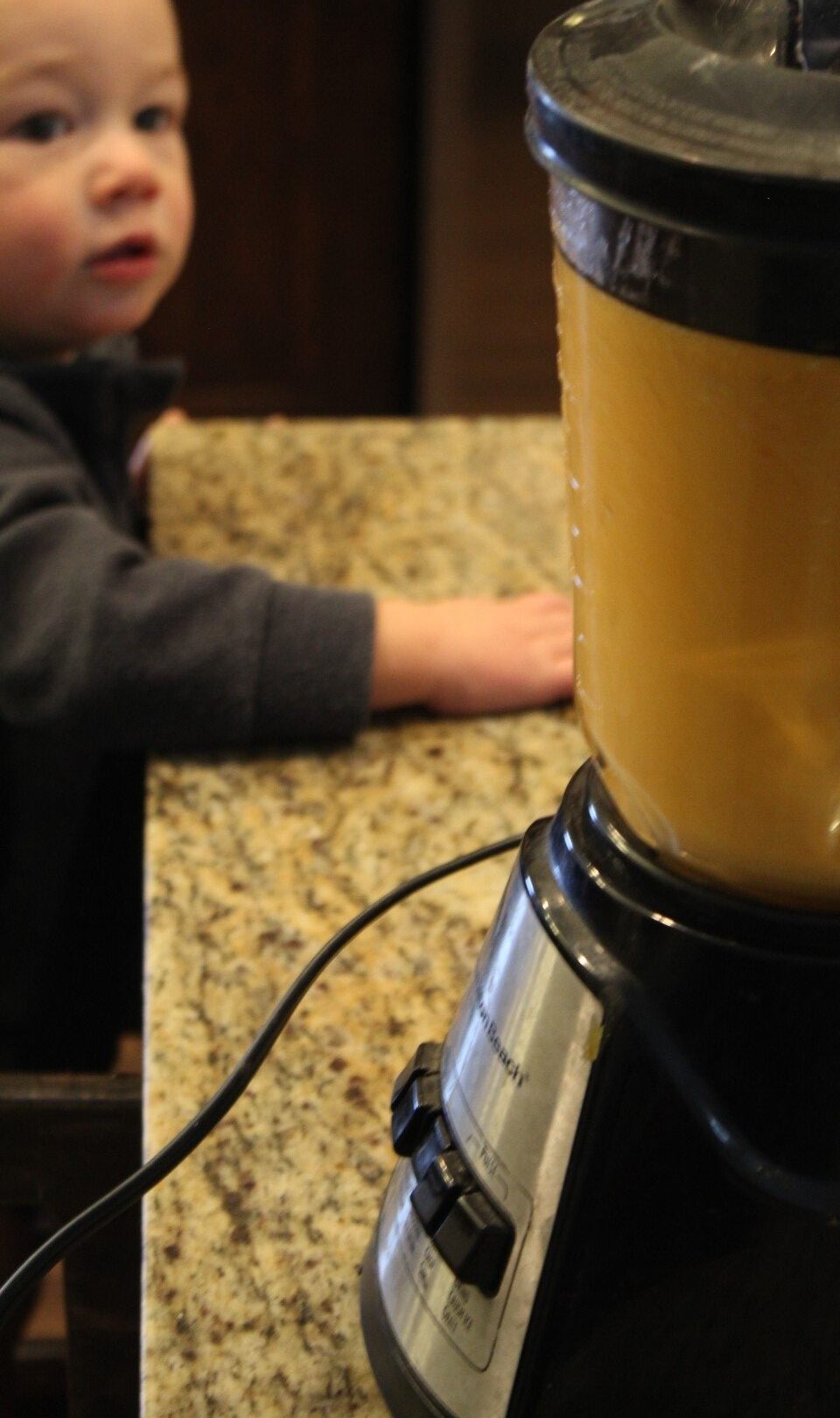 Blending vegetables to create a sauce.