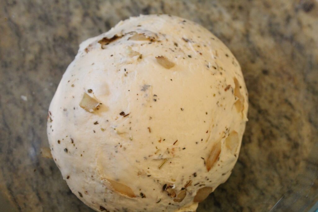 Bagel dough with onions and Italian seasonings. 