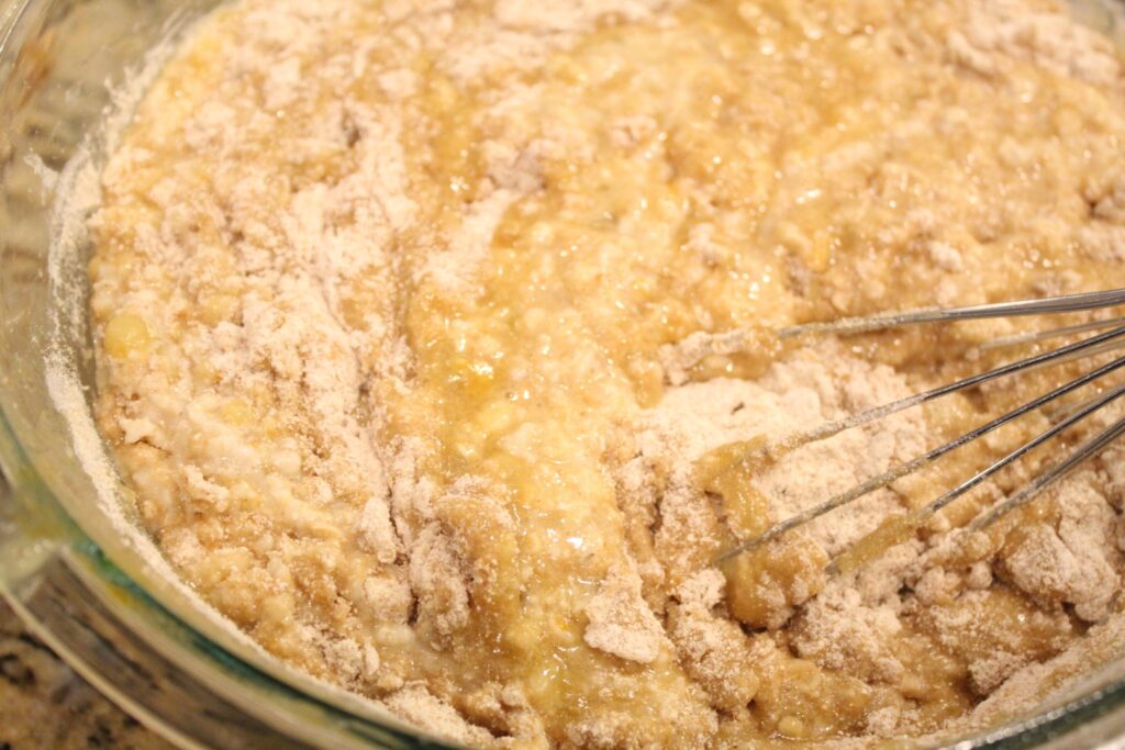 Mixing together banana oat cake batter.