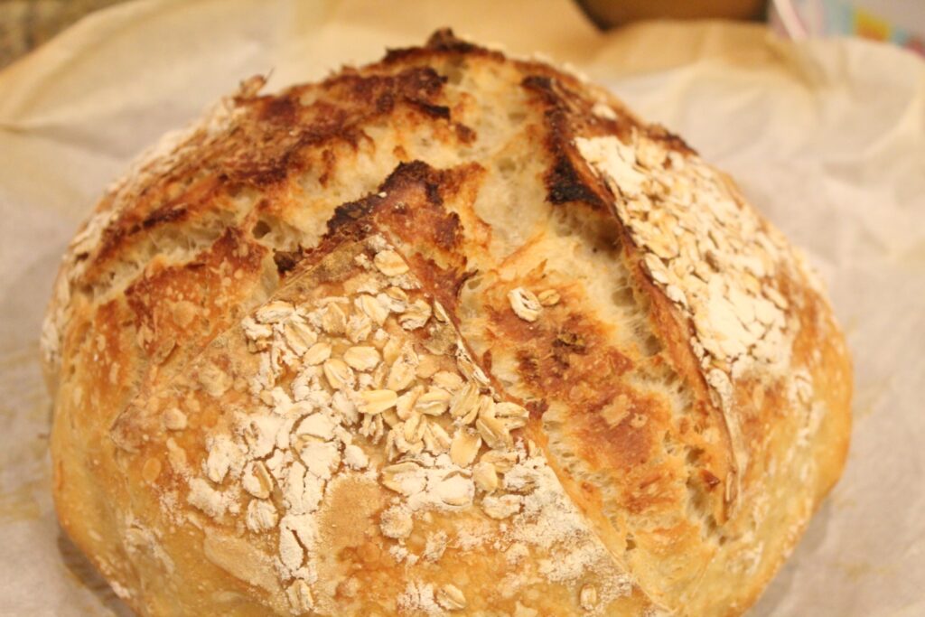 A loaf of sourdough honey oat artisan bread.