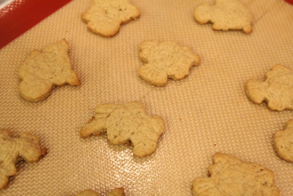 sourdough animal cracker cookies on a baking sheet.