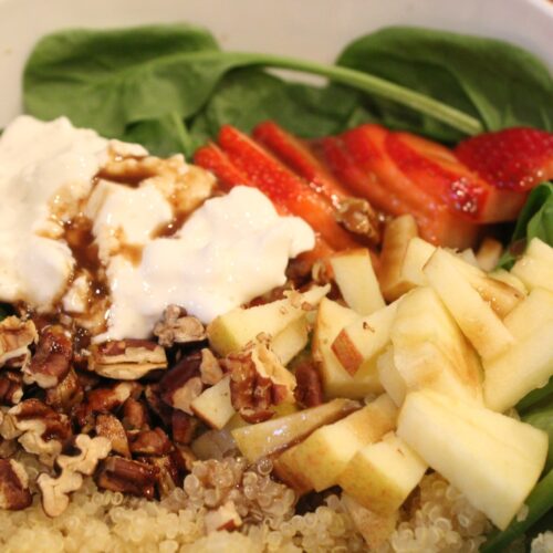 Spinach salad with strawberries, quinoa, apples, pecans, cottage cheese and a balsamic dressing.