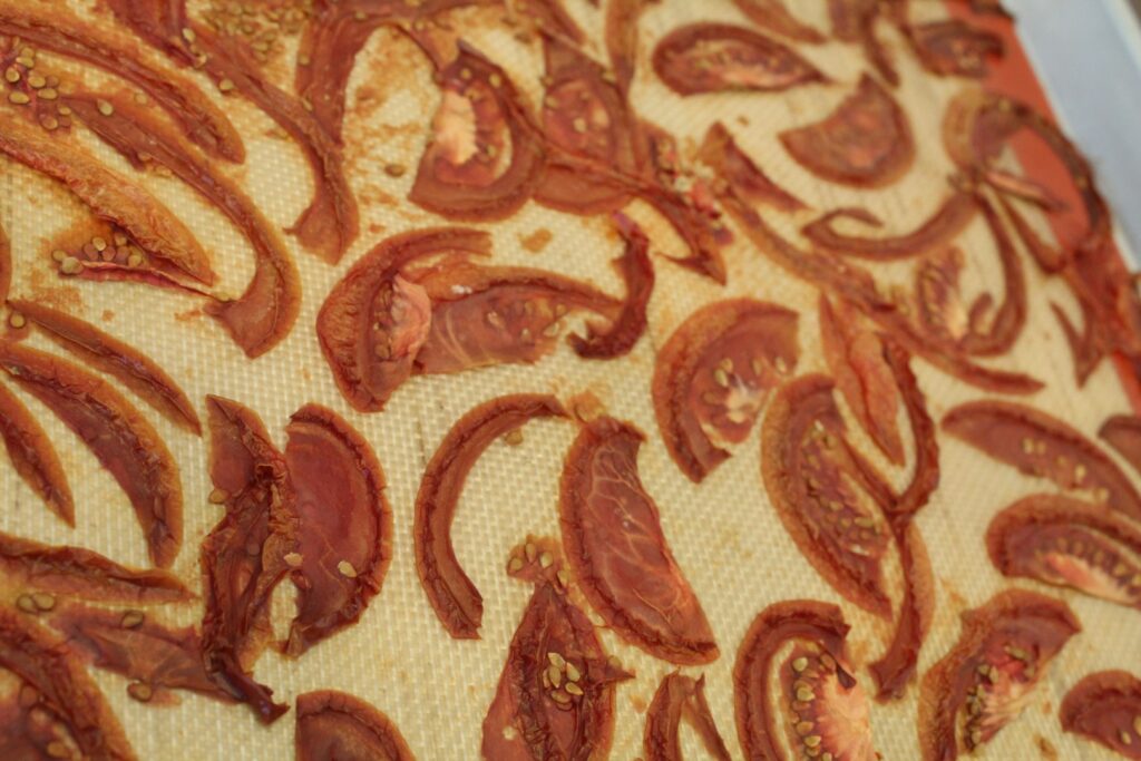 Tomatoes dried on a silicone mat.