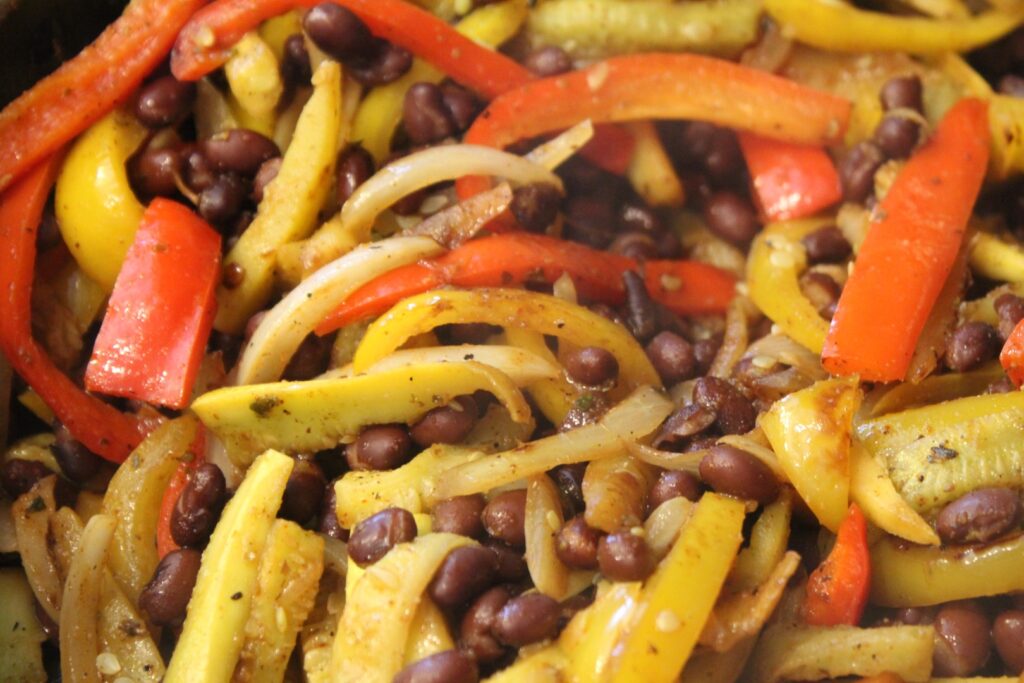 Sauteed zucchini, yellow squash, onions, and peppers with black beans.