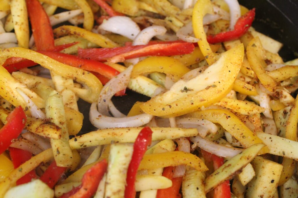 Seasoned vegetables in a pan.