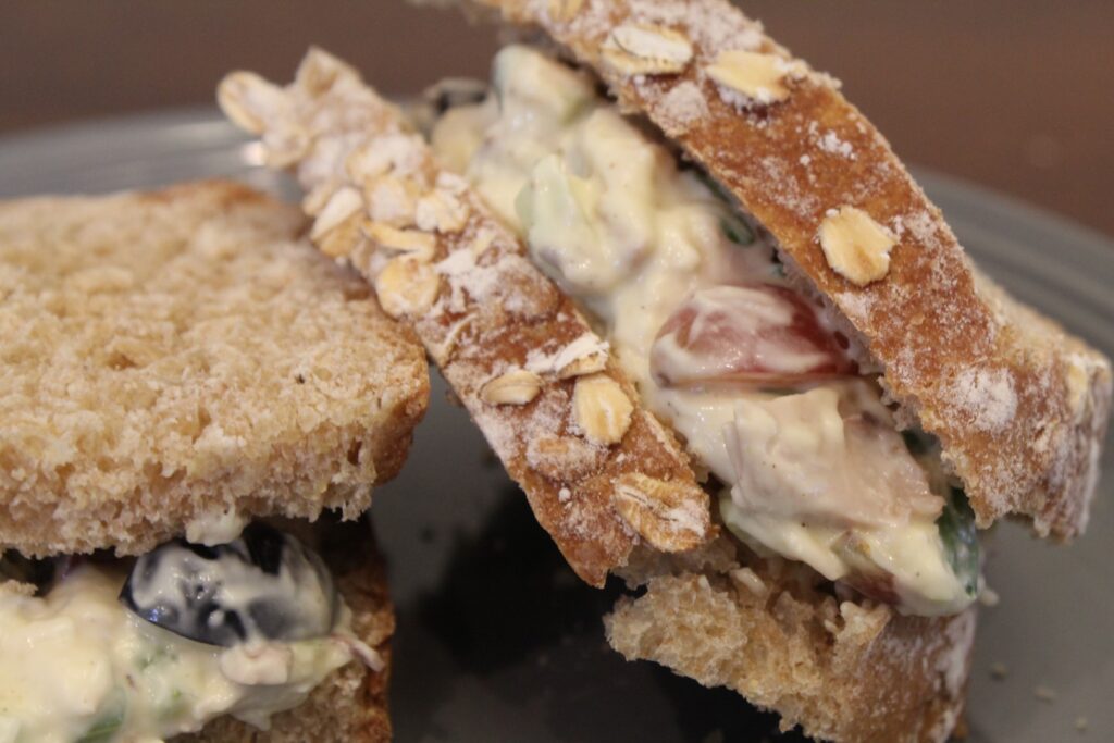 Vegetable and grape chicken salad on oat covered bread