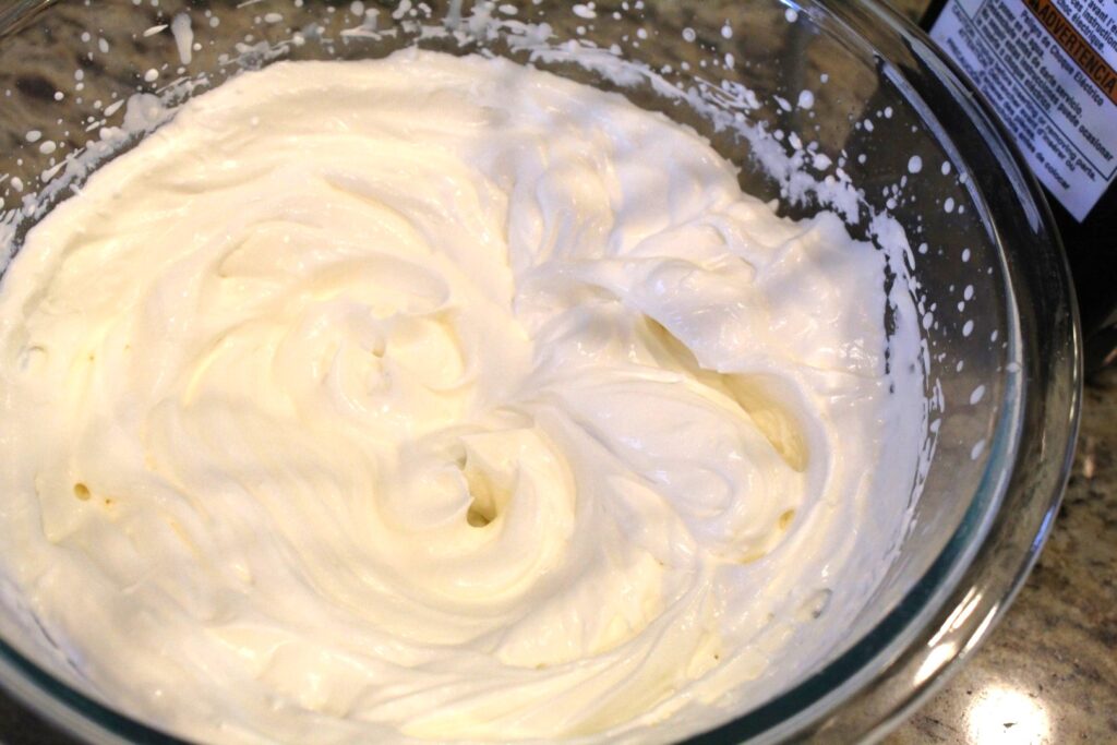 whipped cream in a glass bowl