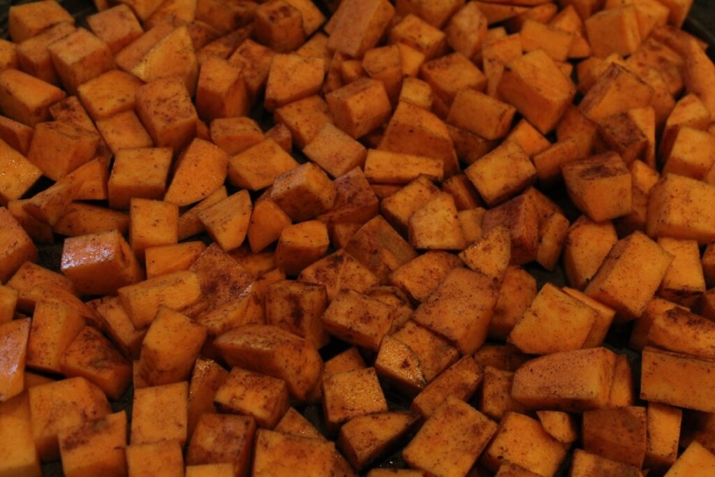 Diced sweet potatoes seasoned with cinnamon.