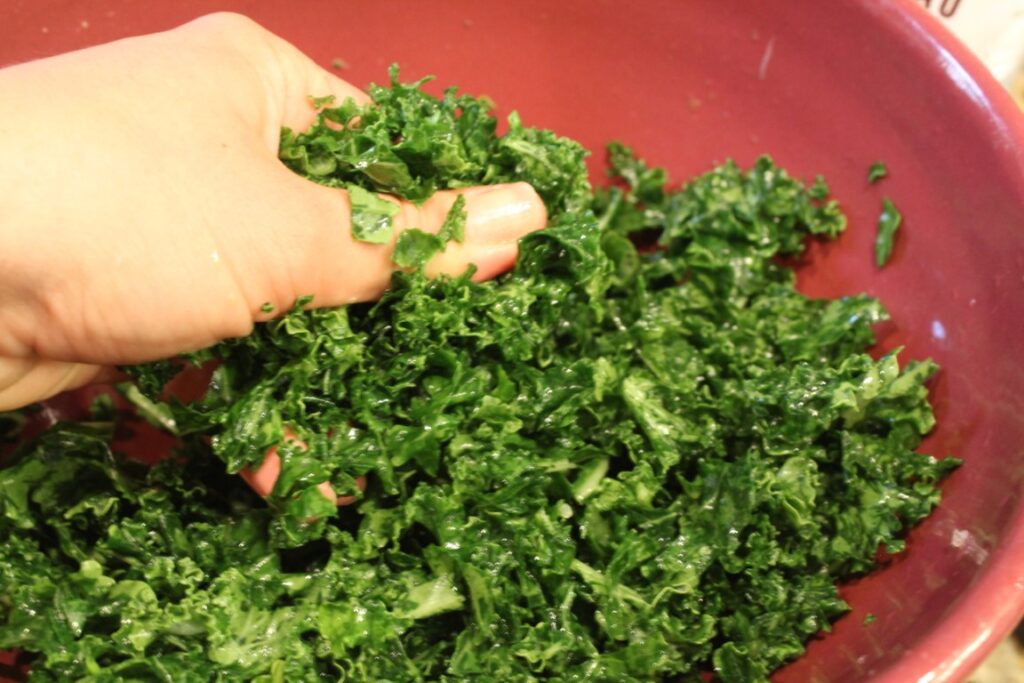 Massaging lemon juice into kale.