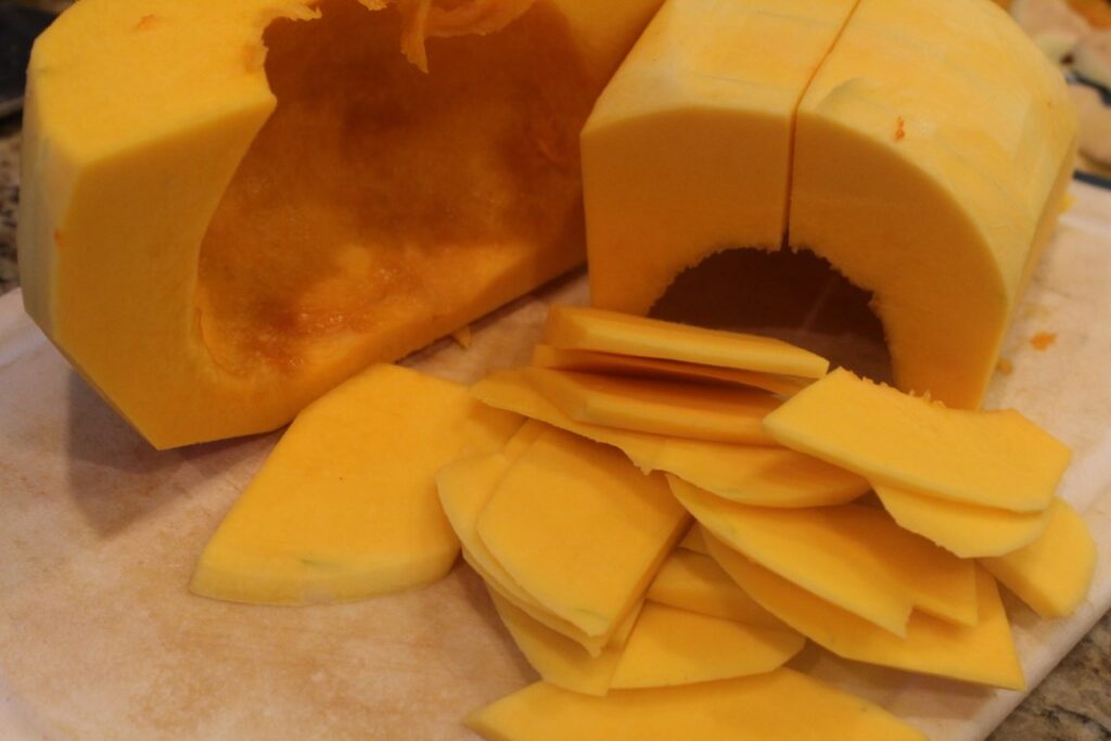 Thinly sliced butternut squash in bite sized pieces.