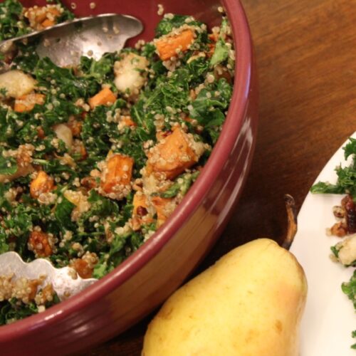 Bowl of Fall kale salad with pear and sweet potato.