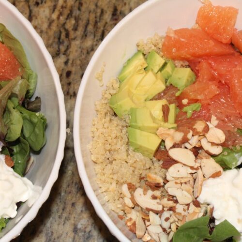 two bowls of Grape fruit salad with avocado, quinoa, almonds, and cottage cheese.