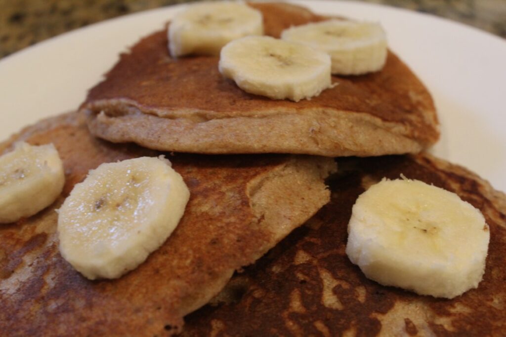 Whole wheat Banana Pancakes topped with banana slices