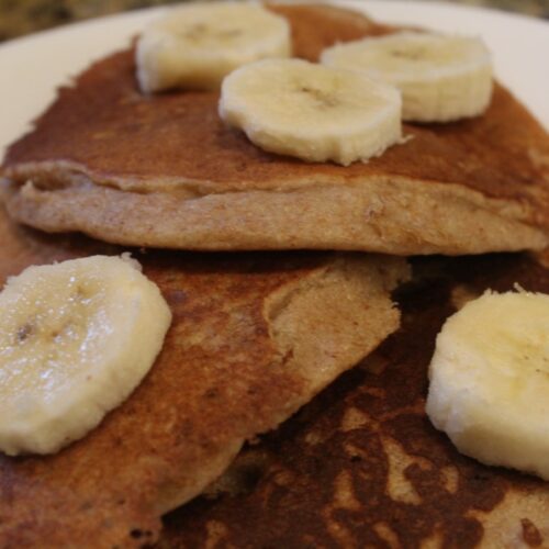 Whole wheat Banana Pancakes topped with banana slices