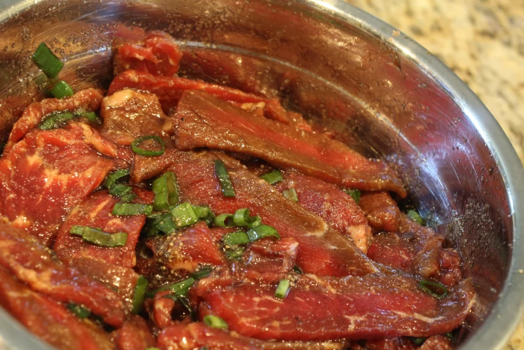 Thinly sliced raw beef mixed with bulgogi marinade