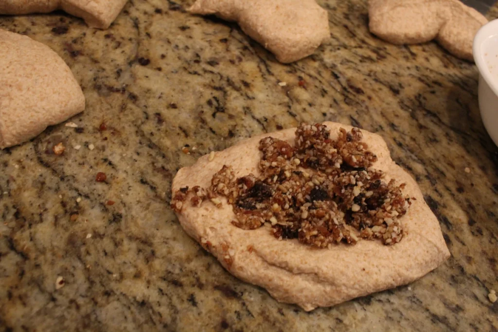 filling on top of a section of sourdough naan dough.