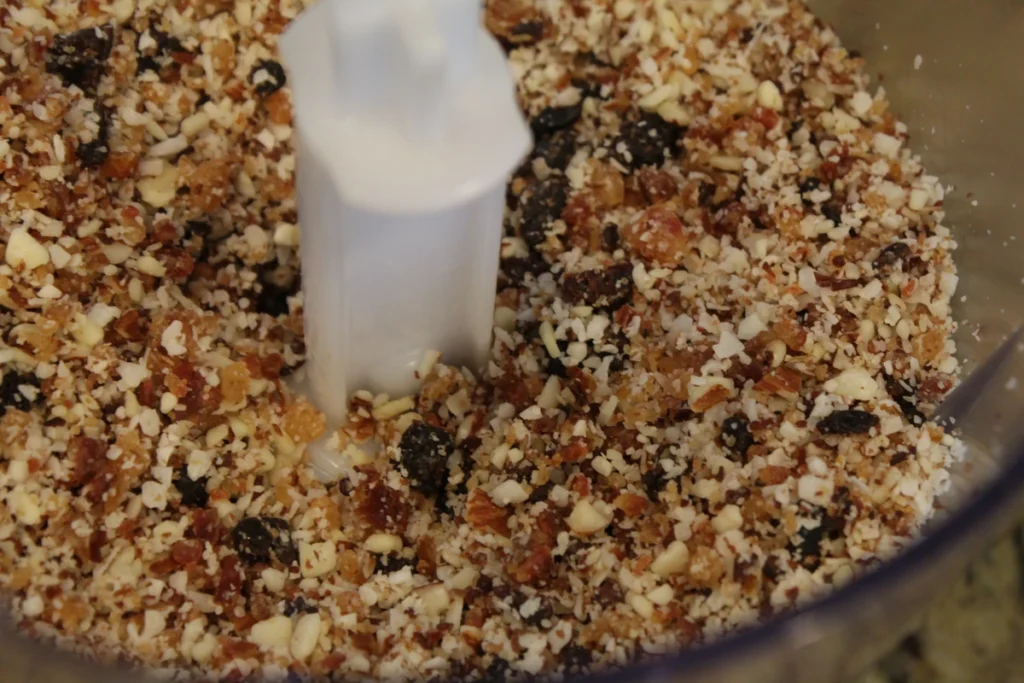 Ground up nuts and dried fruit in a food processor. 