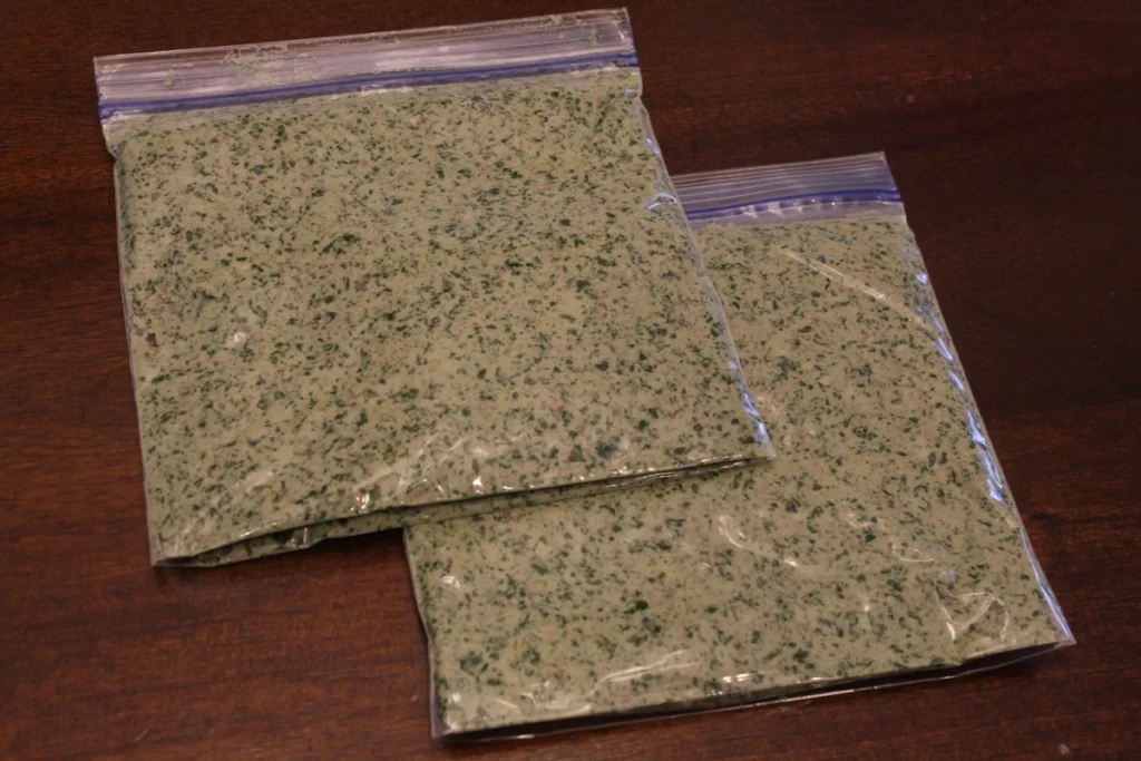 two quart bags of pesto laying flat.