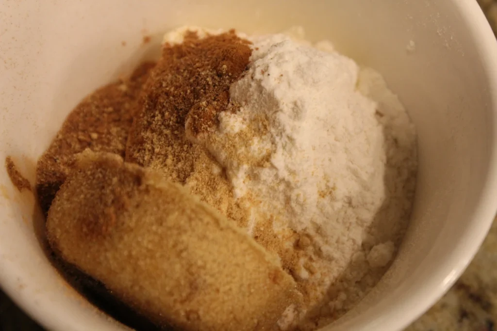 Flour spices and brown sugar in a bowl.