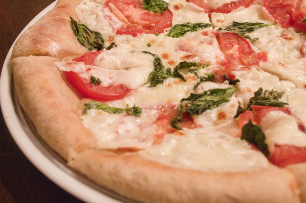 sliced tomato basil pizza 