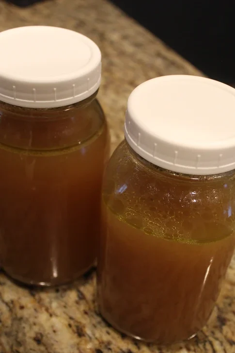 Glass jars filled with home made bone broth