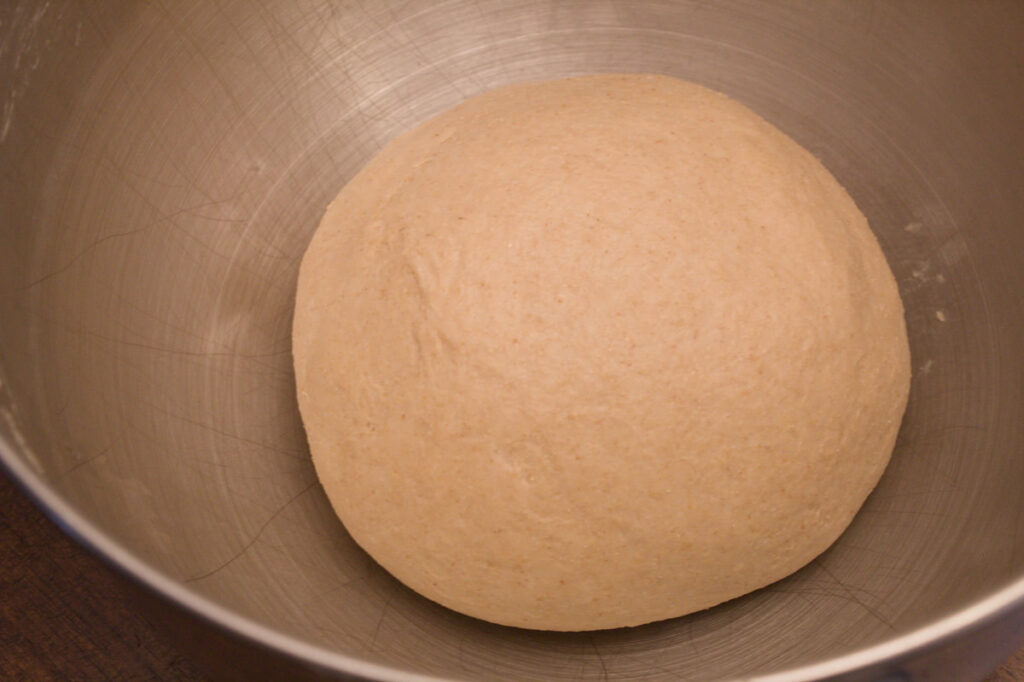 Roll dough in a bowl ready to rise.